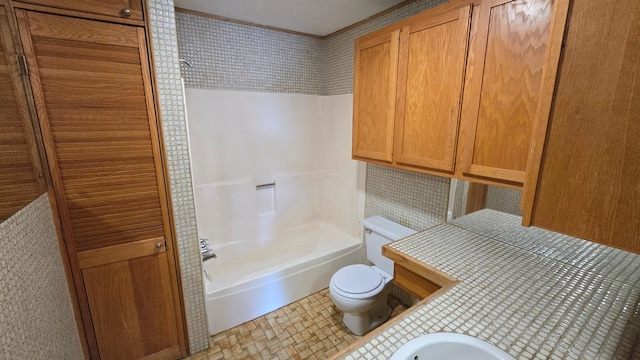 full bathroom with toilet, tub / shower combination, and sink