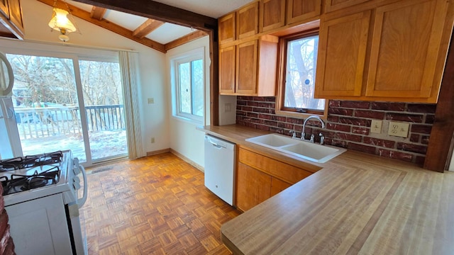 kitchen with sink, white appliances, light parquet floors, tasteful backsplash, and lofted ceiling with beams