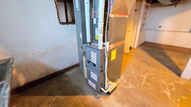 utility room featuring heating unit