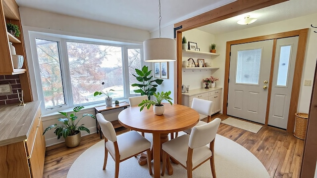 dining space featuring light wood-type flooring