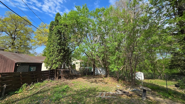 3343 Drew Ave N, Robbinsdale, MN 55422 - view of yard featuring fence, a storage shed, and an outdoor structure