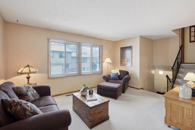 living room featuring a textured ceiling, carpet flooring, visible vents, baseboards, and stairs