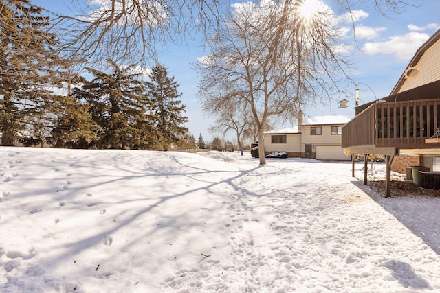 view of yard layered in snow