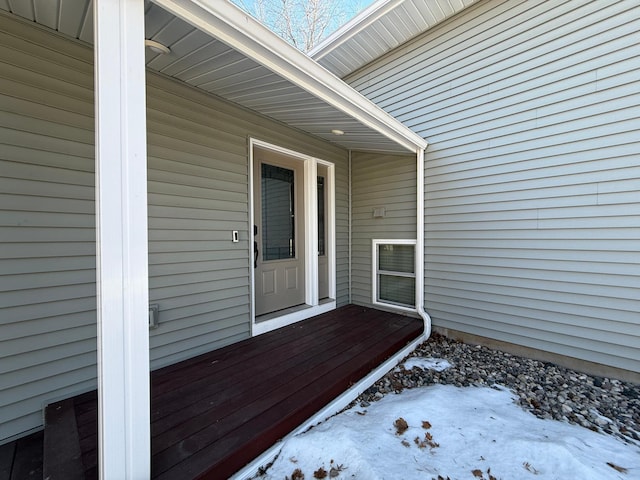 view of snow covered property entrance