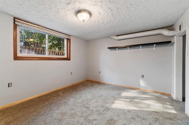 unfurnished bedroom with carpet and a textured ceiling