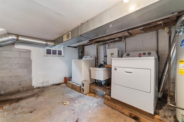 basement featuring electric panel, sink, and water heater