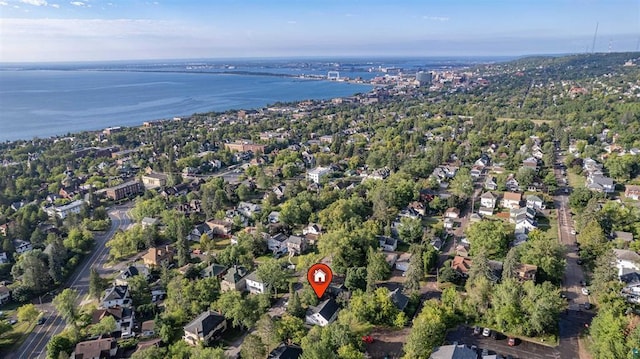 birds eye view of property with a water view