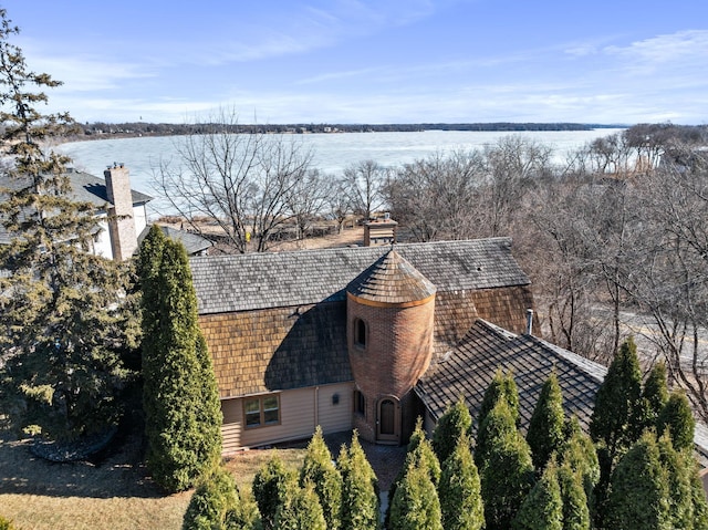 birds eye view of property with a water view