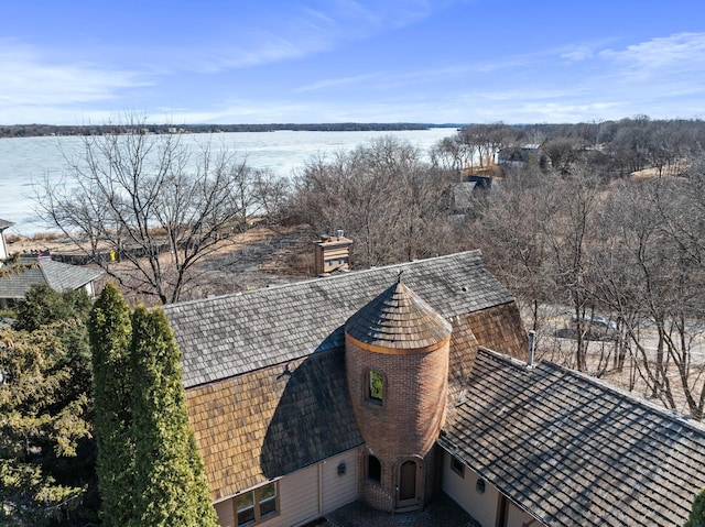 birds eye view of property featuring a water view