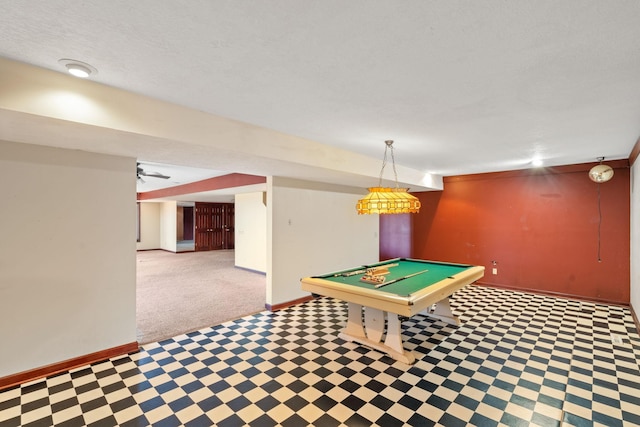 recreation room with pool table, a textured ceiling, and baseboards