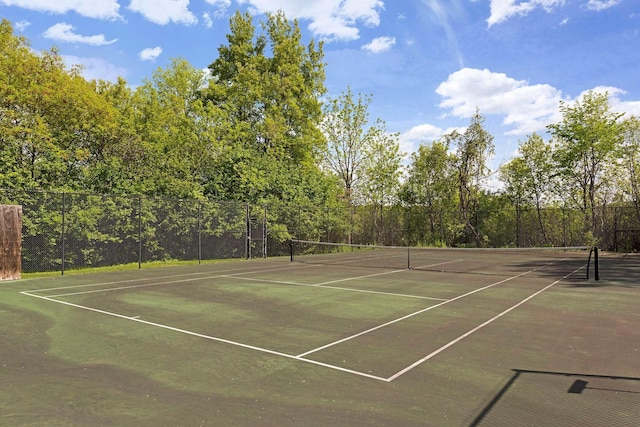 view of tennis court with fence