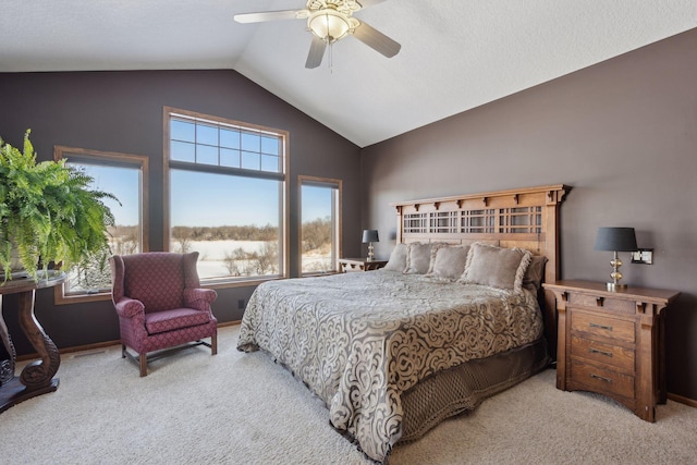 bedroom featuring lofted ceiling, ceiling fan, and light colored carpet