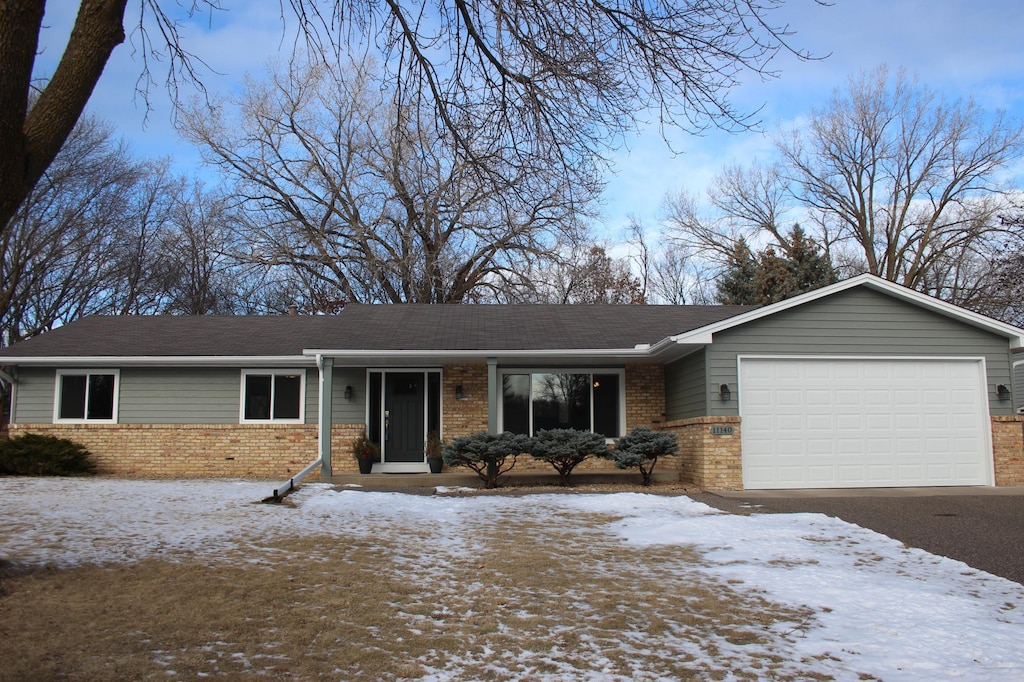 single story home with a garage