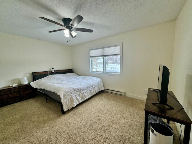 bedroom with ceiling fan, a textured ceiling, light carpet, and a baseboard heating unit