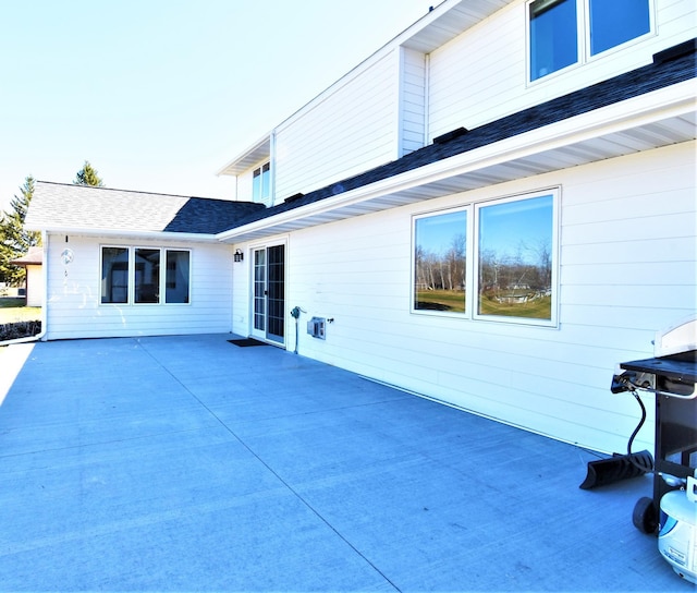 back of property featuring a patio