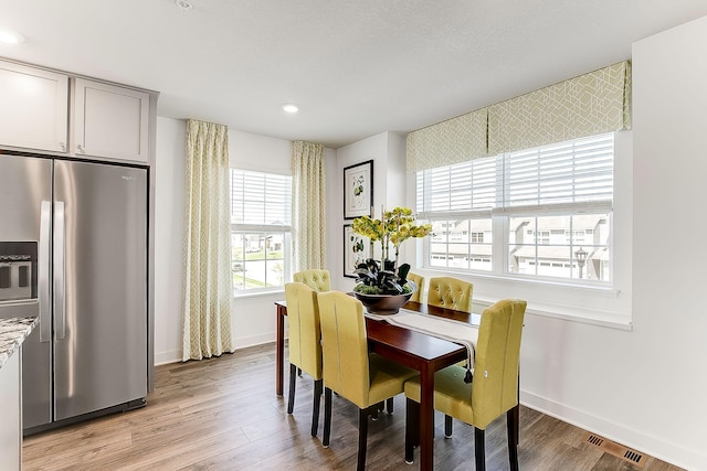 dining space featuring light hardwood / wood-style floors