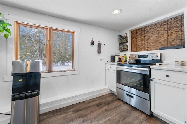 kitchen with white cabinetry, stainless steel electric range oven, and dark hardwood / wood-style floors