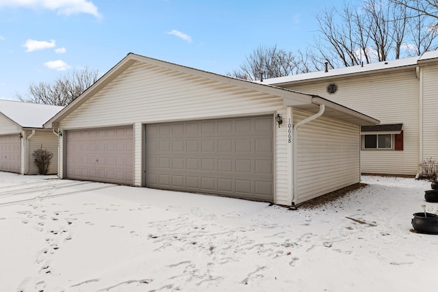 view of snow covered garage