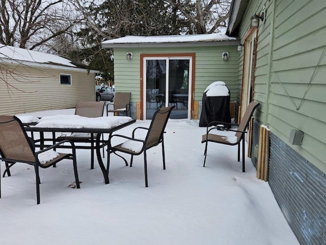 view of snow covered patio