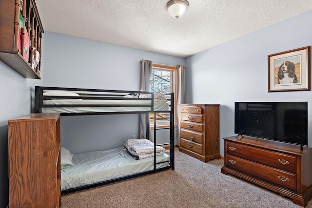 carpeted bedroom with a textured ceiling