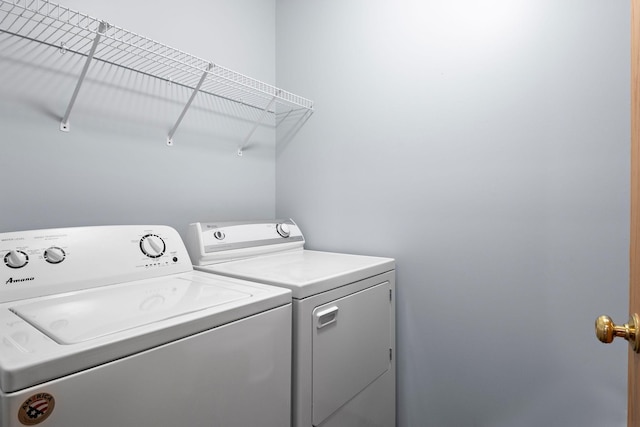 laundry area featuring washing machine and clothes dryer