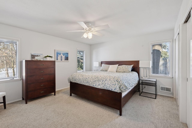 carpeted bedroom featuring ceiling fan