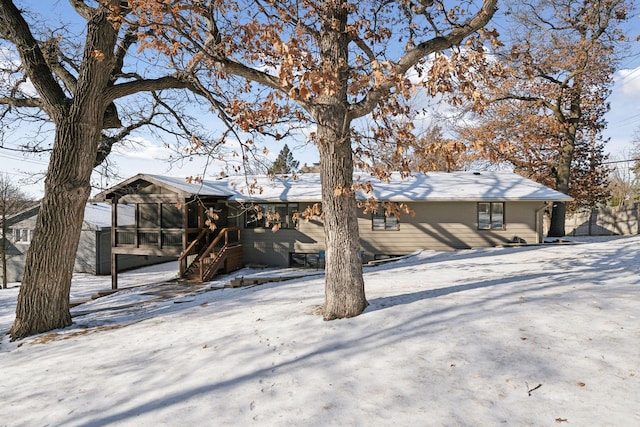 view of front facade featuring a sunroom