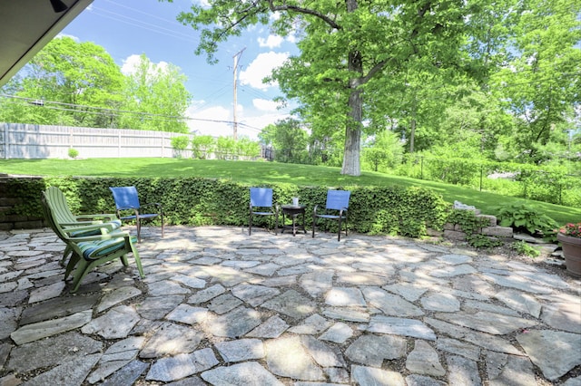 view of patio featuring fence