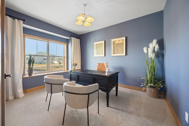 office area featuring light colored carpet, a textured ceiling, and an inviting chandelier