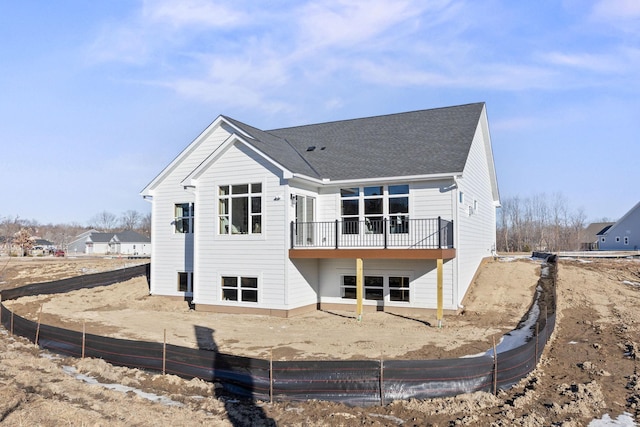 back of house with a deck