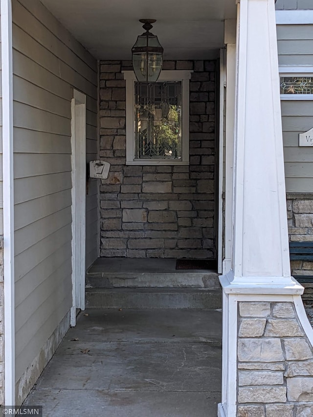 view of exterior entry with stone siding