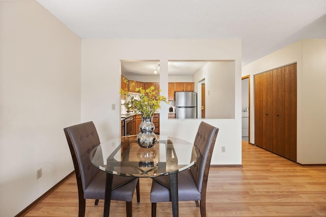 dining room with light wood-type flooring