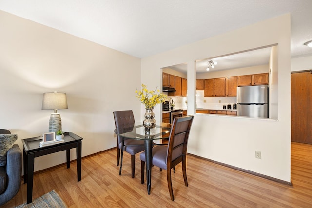 dining room featuring light hardwood / wood-style flooring