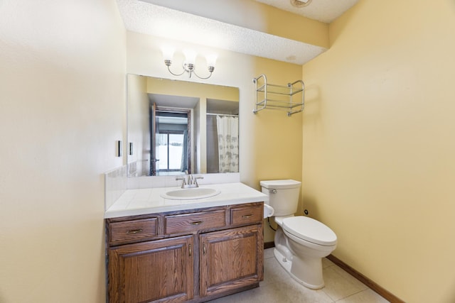 full bath with baseboards, toilet, tile patterned floors, a textured ceiling, and vanity