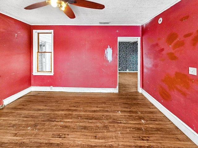 unfurnished room featuring ceiling fan and dark hardwood / wood-style flooring