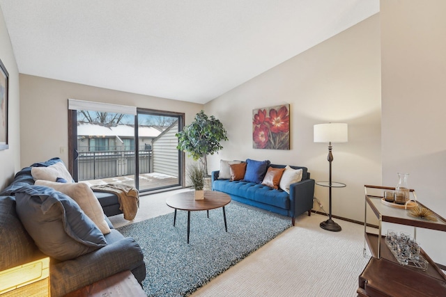 carpeted living room with vaulted ceiling