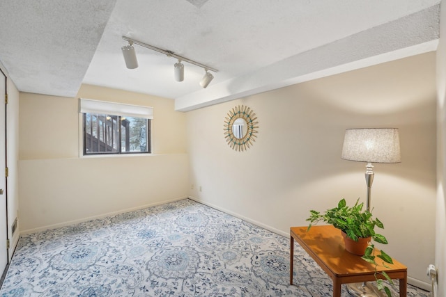 interior space with a textured ceiling