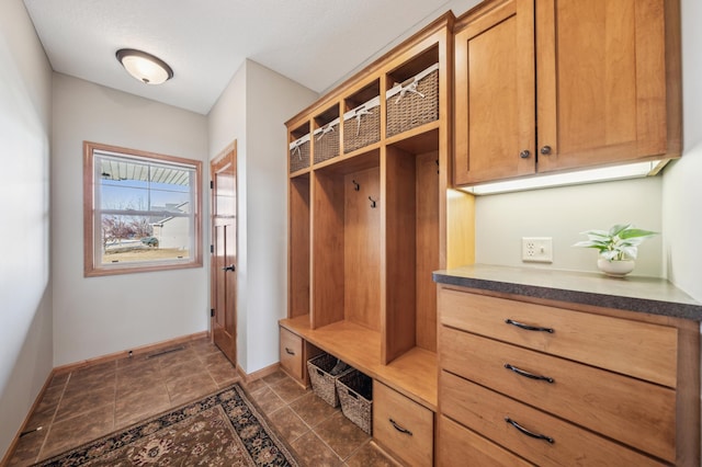 mudroom featuring baseboards