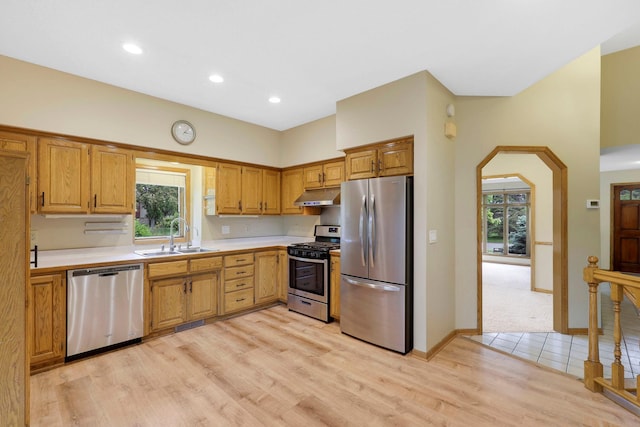5639 Park Place Dr, Shoreview, MN 55126 - kitchen with appliances with stainless steel finishes, a sink, under cabinet range hood, light countertops, and plenty of natural light