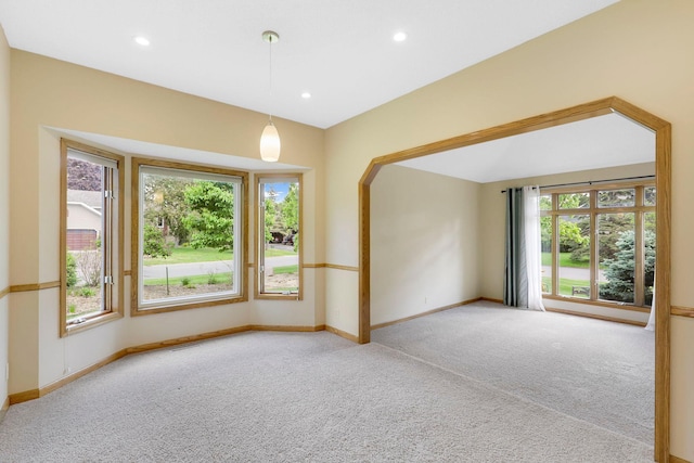 5639 Park Place Dr, Shoreview, MN 55126 - carpeted spare room featuring plenty of natural light, baseboards, recessed lighting, and arched walkways