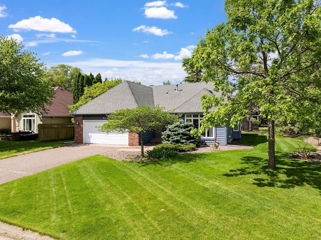 5639 Park Place Dr, Shoreview, MN 55126 - view of front of home featuring driveway, a garage, brick siding, and a shingled roof