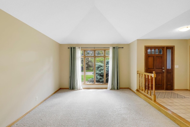 5639 Park Place Dr, Shoreview, MN 55126 - unfurnished room featuring baseboards, lofted ceiling, and light carpet