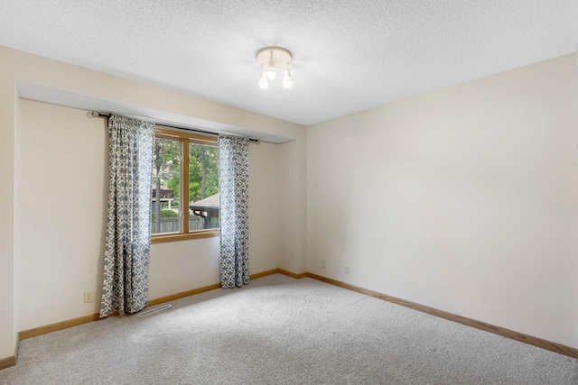5639 Park Place Dr, Shoreview, MN 55126 - unfurnished room featuring carpet floors, baseboards, and a textured ceiling