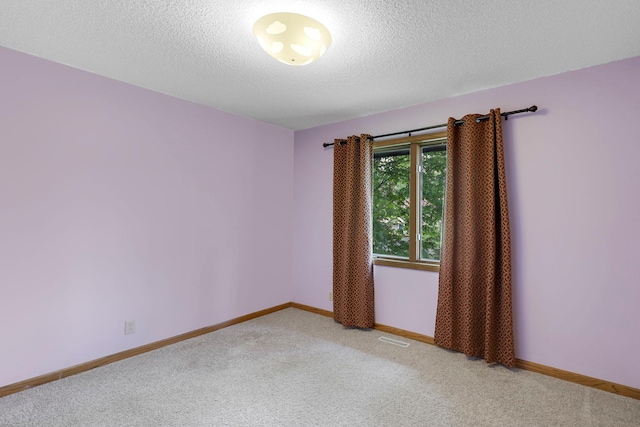 5639 Park Place Dr, Shoreview, MN 55126 - unfurnished room with light carpet, a textured ceiling, and baseboards