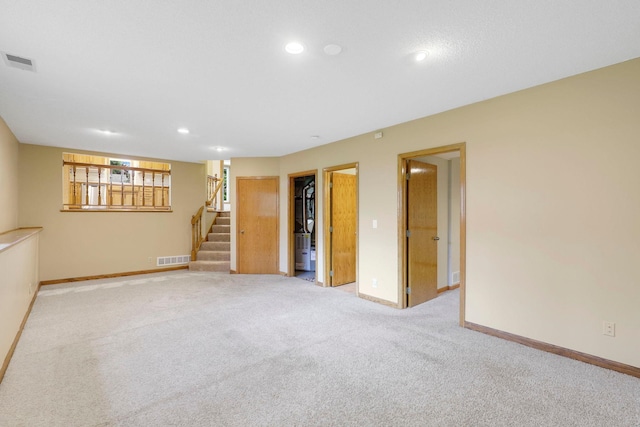 5639 Park Place Dr, Shoreview, MN 55126 - below grade area with stairway, baseboards, recessed lighting, and carpet floors