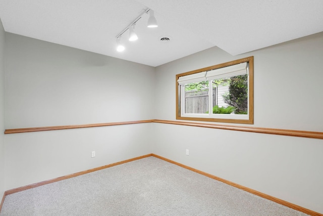 5639 Park Place Dr, Shoreview, MN 55126 - spare room with track lighting, carpet, and baseboards
