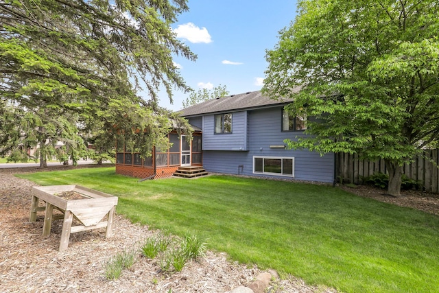 5639 Park Place Dr, Shoreview, MN 55126 - back of property with a sunroom and roof with shingles
