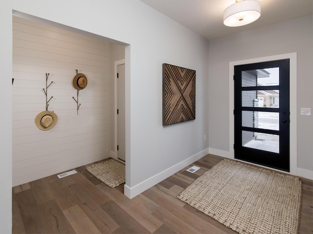 entryway with wood-type flooring