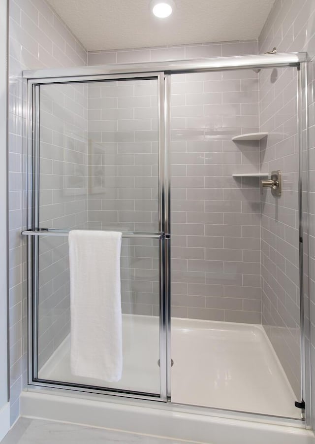 bathroom with an enclosed shower