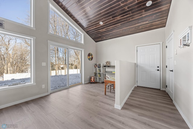 entrance foyer featuring wood ceiling, high vaulted ceiling, and light wood-type flooring